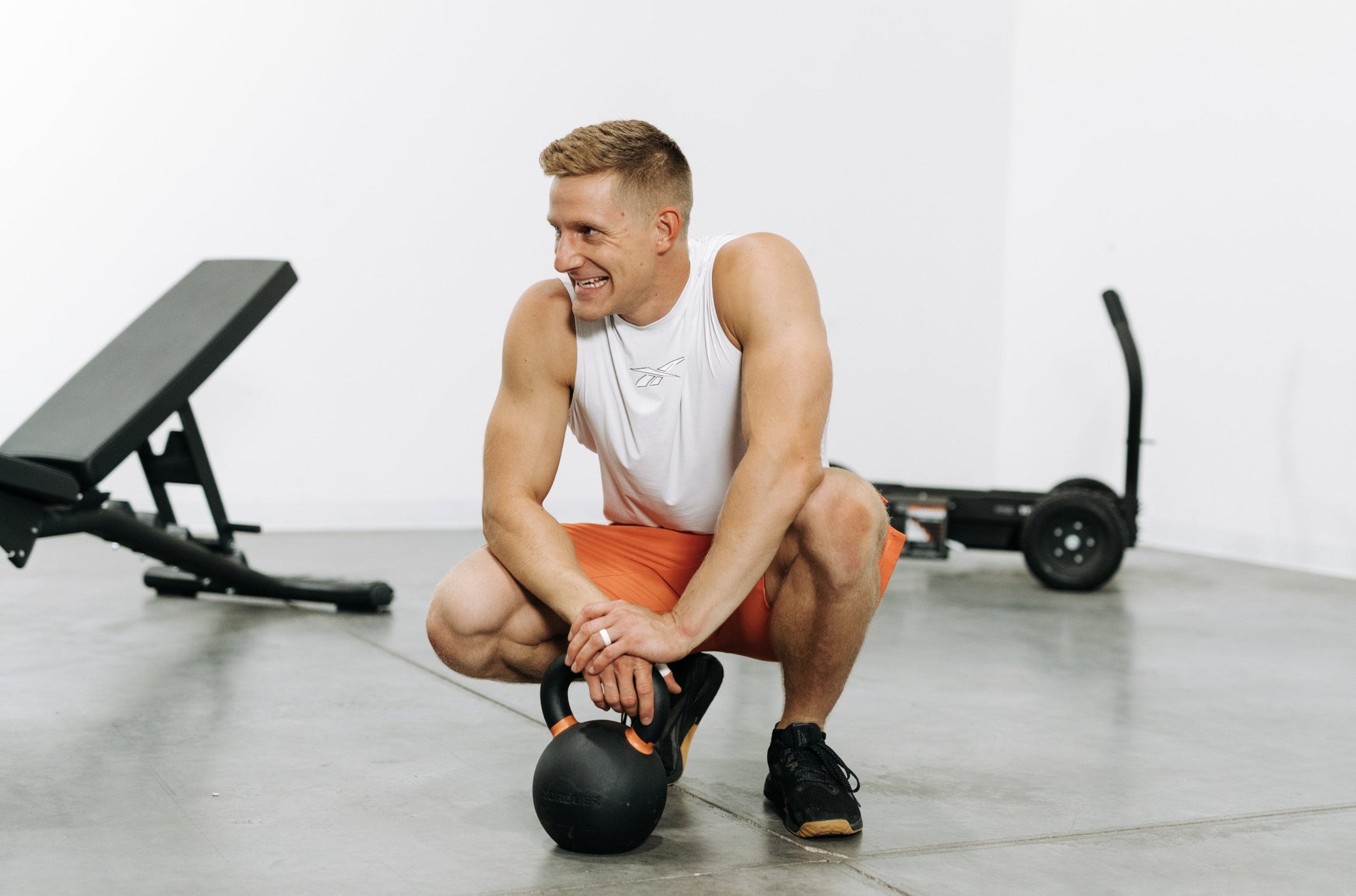 Brent Fikowski Smiling With Orange Torque Kettlebell <black>
