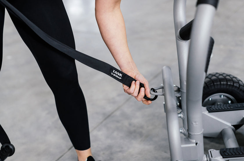 Woman Clipping TANK V-Strap Onto TANK MX